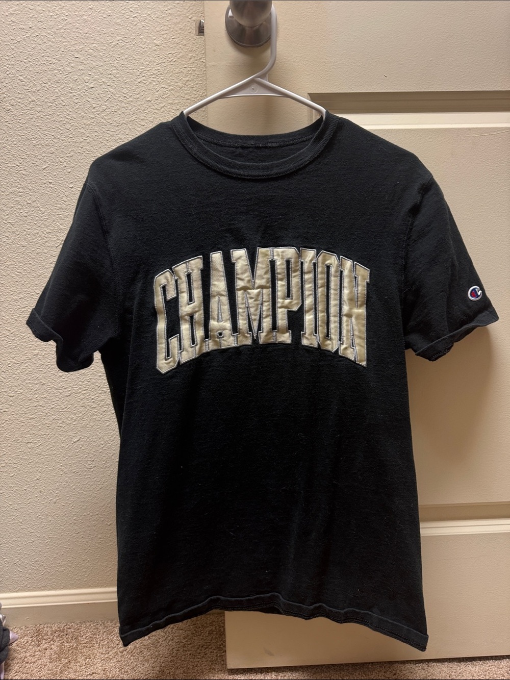 Champion Black Tee with Cream Arch Logo